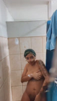 Busty teen films herself taking a shower